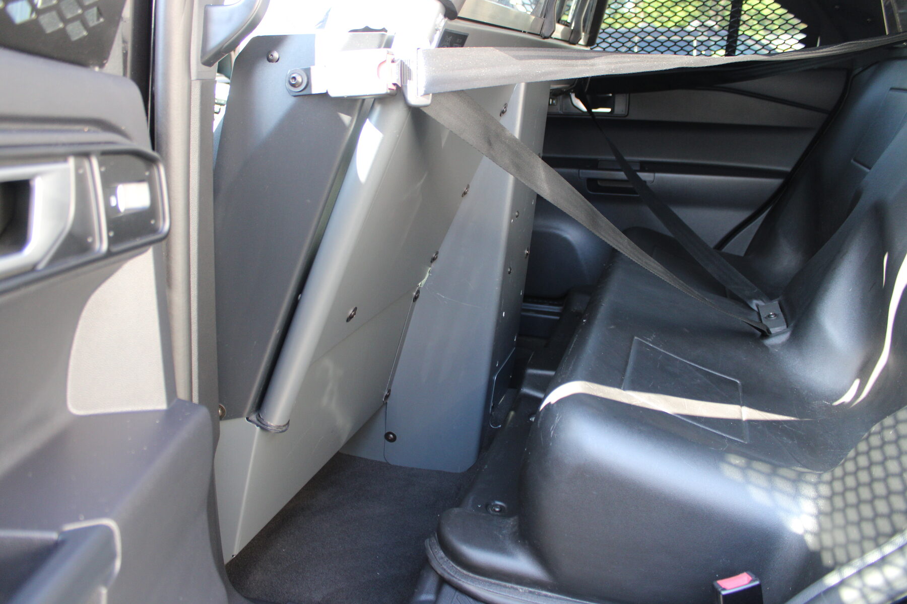 Rear transport seat and partition