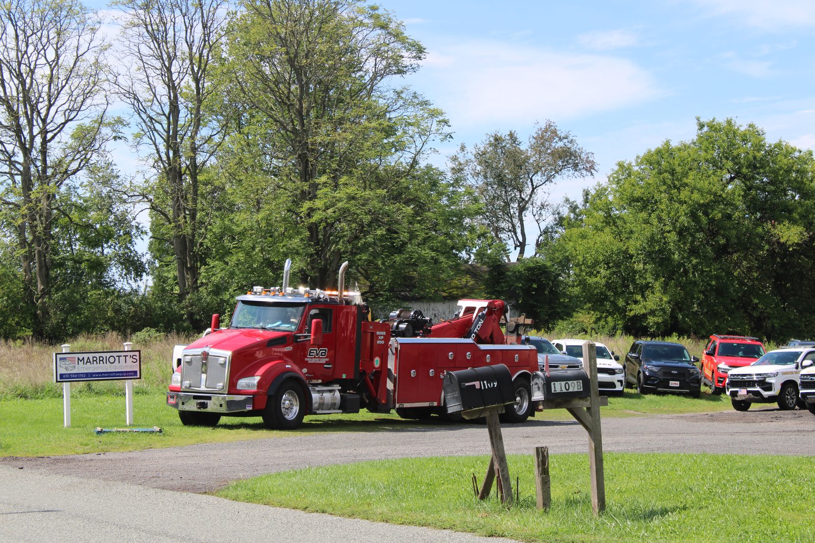 The finished truck alongside other units at the shop