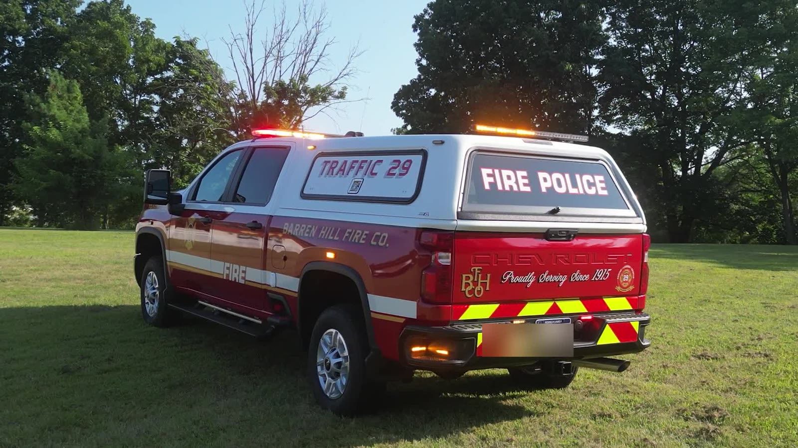 Rear three-quarter showing the cap lightbar and TRAFFIC 29 lettering