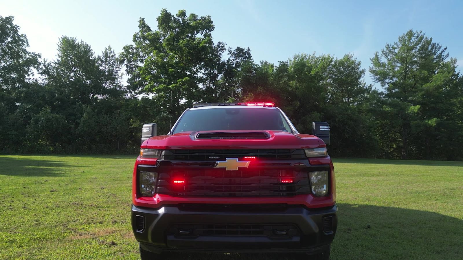 Head-on front with grille and roof warning